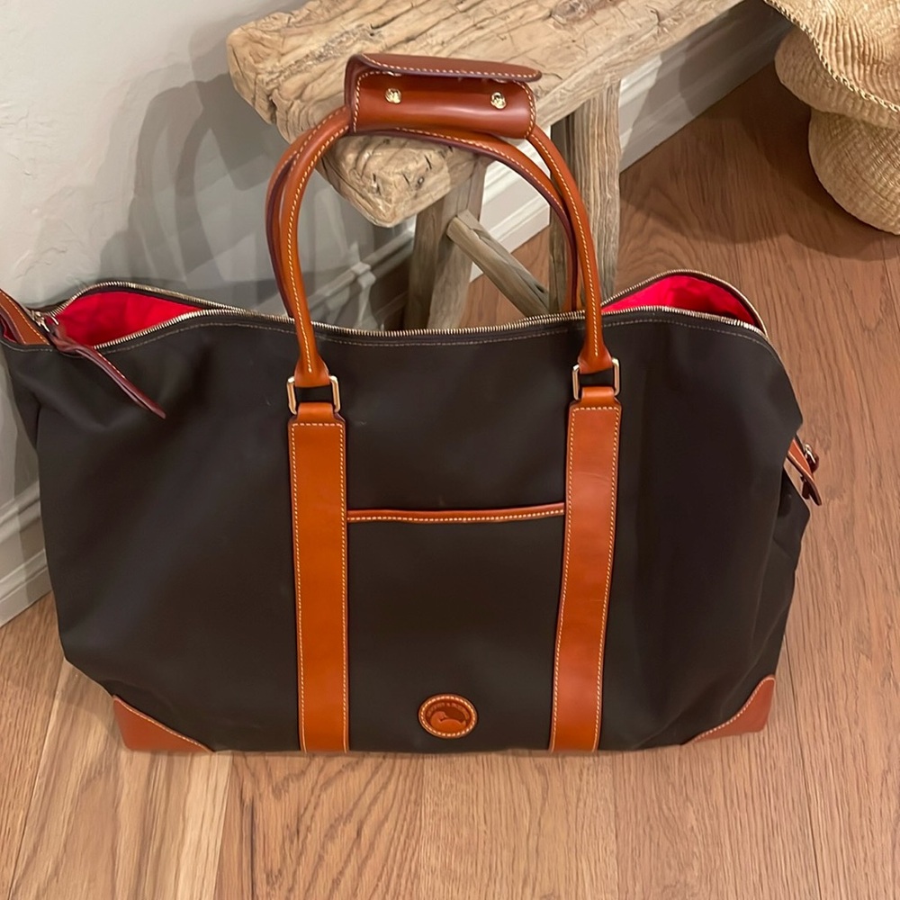 Dooney & Bourke Cabriolet travel bag.  New never used.